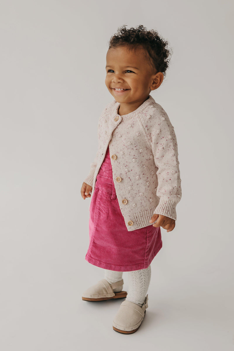 Jamie Kay Wanderlust Collection 20% off - toddler in blossom corduroy dress and dotty cardigan